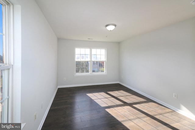 spare room with wood-type flooring