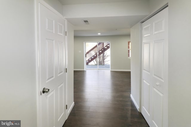 hallway with dark wood-type flooring