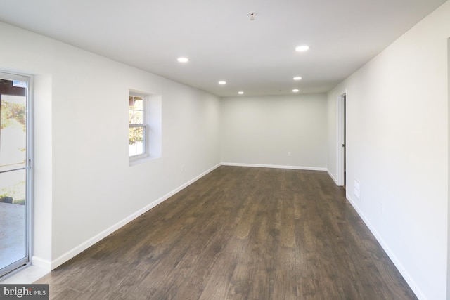 spare room featuring dark hardwood / wood-style flooring