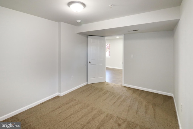 unfurnished room with carpet floors