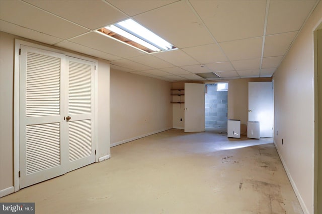 basement featuring a paneled ceiling