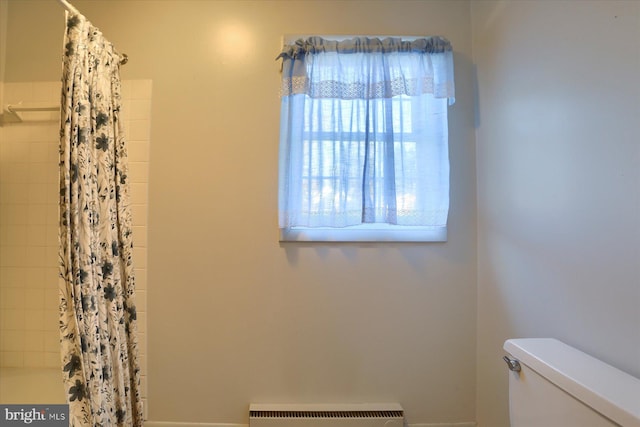 bathroom featuring radiator heating unit and toilet