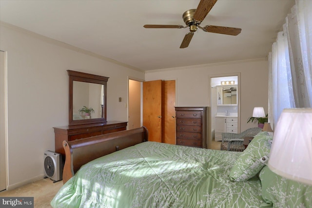 carpeted bedroom featuring connected bathroom, sink, crown molding, and ceiling fan