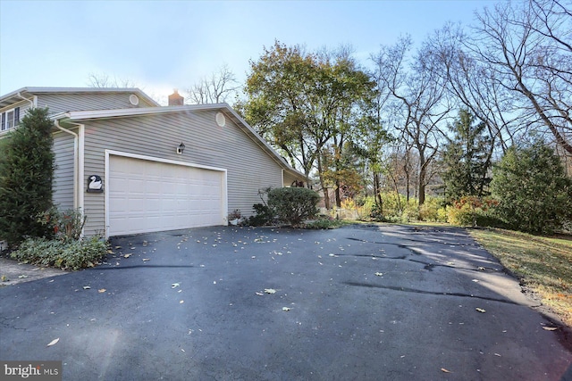 view of property exterior with a garage