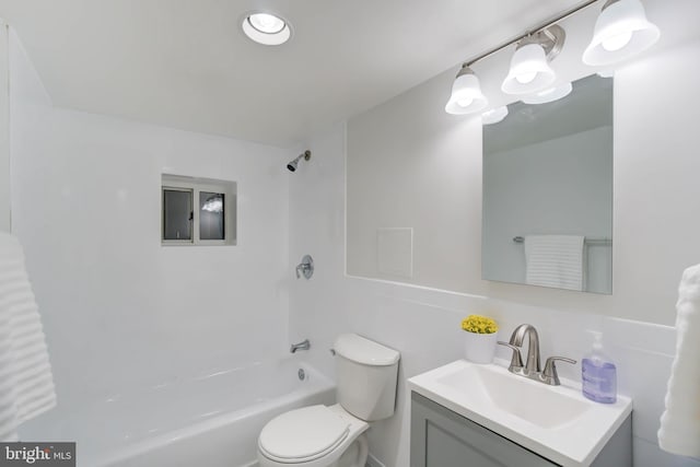 full bathroom featuring  shower combination, vanity, and toilet