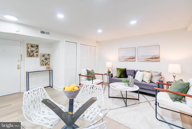 living room with light hardwood / wood-style floors