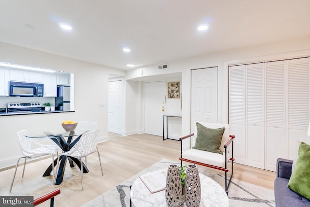 sitting room featuring light hardwood / wood-style floors