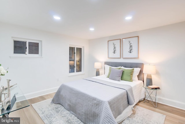 bedroom with hardwood / wood-style floors