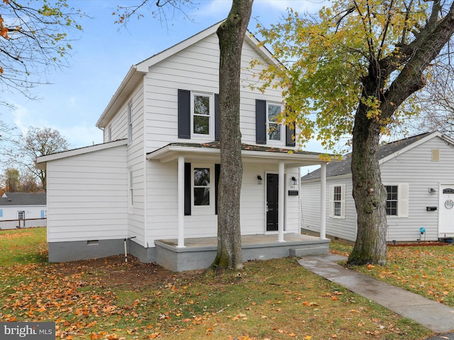 front facade featuring a front yard and a porch