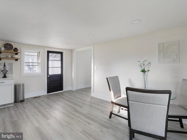 unfurnished dining area with light hardwood / wood-style flooring