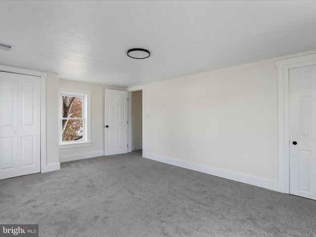 unfurnished bedroom featuring carpet flooring