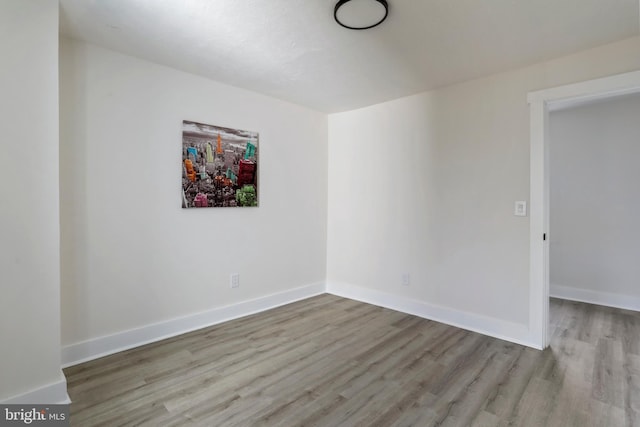 unfurnished room featuring light hardwood / wood-style floors