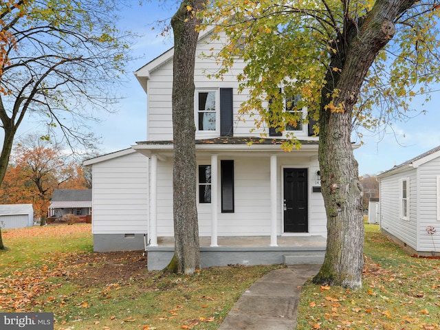 view of front of home featuring a porch and a front yard