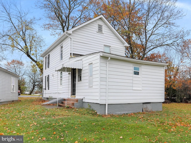 exterior space featuring a front lawn