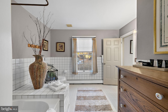1324 River Rd, New Hope, PA 18938 - full bath with tile walls, a baseboard radiator, vanity, a bath, and wainscoting