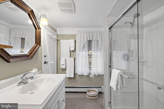 bathroom with an enclosed shower, vanity, baseboard heating, and ornamental molding