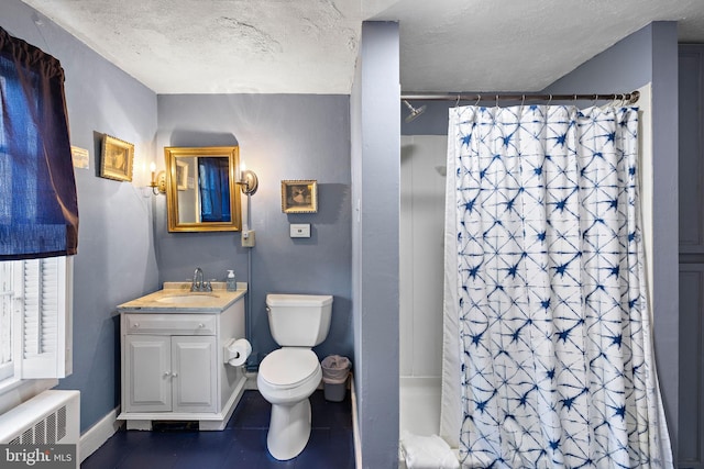 bathroom with radiator, vanity, a textured ceiling, and curtained shower