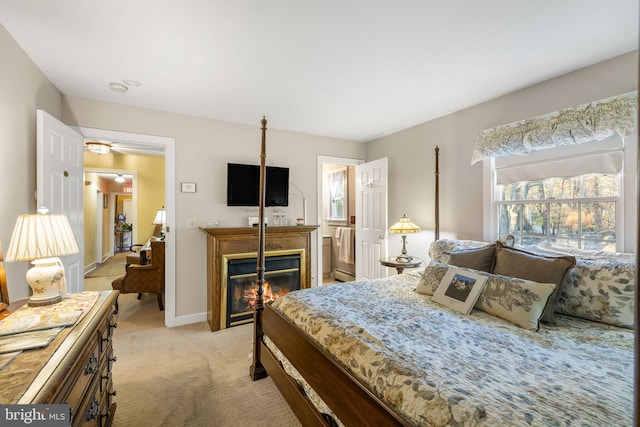 1324 River Rd, New Hope, PA 18938 - bedroom with light carpet, a glass covered fireplace, and baseboards