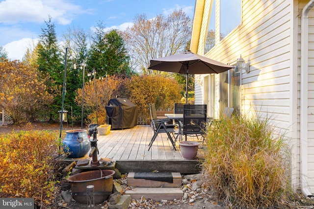 wooden deck featuring grilling area