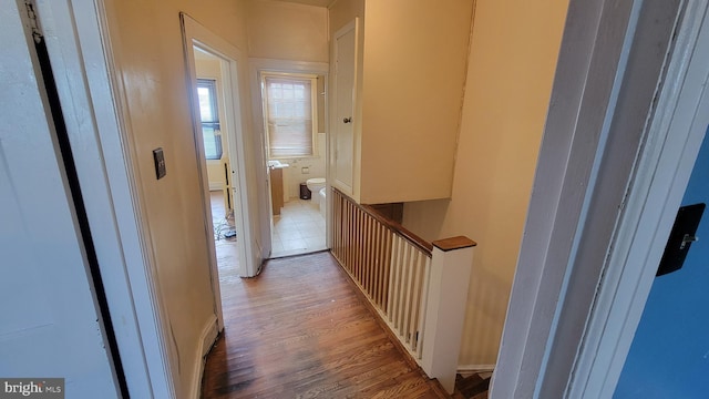 corridor with light wood-type flooring