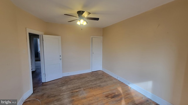 unfurnished bedroom with hardwood / wood-style floors and ceiling fan