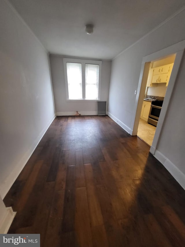 empty room with dark wood-type flooring