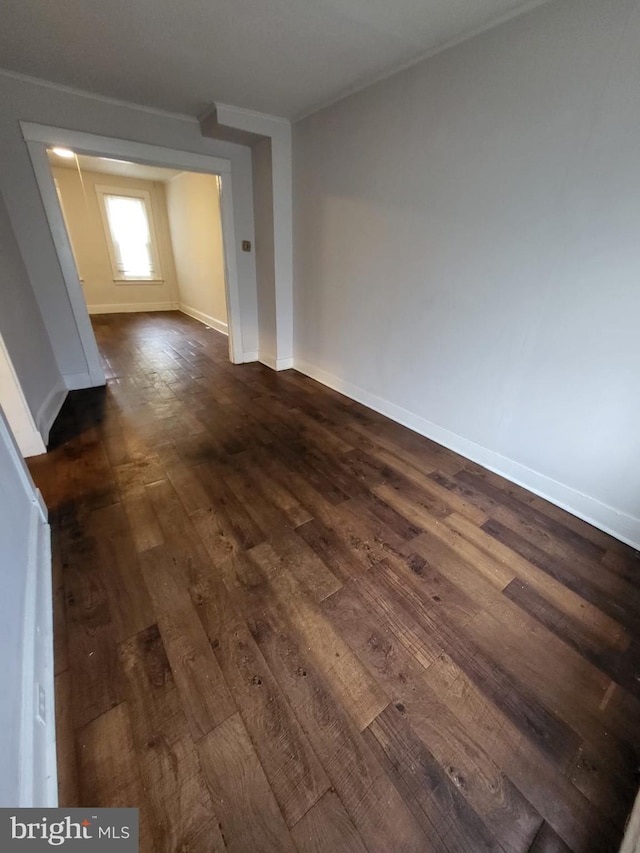 spare room featuring dark hardwood / wood-style flooring