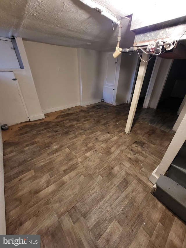 basement featuring dark wood-type flooring