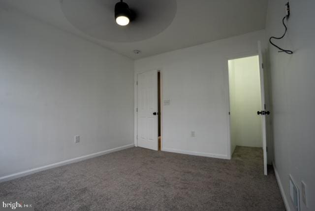 2614 Grogan Ave, Baltimore, MD 21213 - unfurnished bedroom with carpet floors, baseboards, and ceiling fan