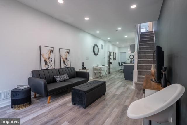 2614 Grogan Ave, Baltimore, MD 21213 - living area with stairway, light wood-type flooring, and recessed lighting