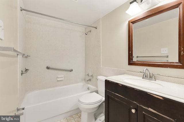 full bathroom featuring vanity, tiled shower / bath combo, and toilet