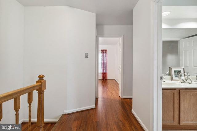 hallway with dark wood-type flooring