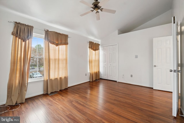 unfurnished room featuring lofted ceiling, hardwood / wood-style flooring, and ceiling fan