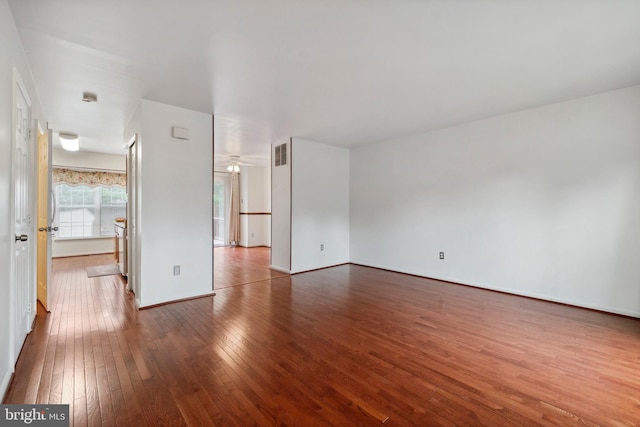 empty room with hardwood / wood-style floors