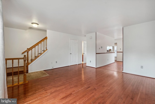 unfurnished living room with wood-type flooring