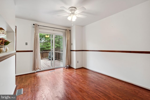 empty room with hardwood / wood-style floors and ceiling fan