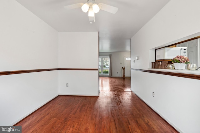 empty room featuring ceiling fan and wood-type flooring