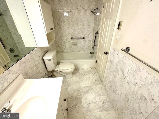 full bathroom with vanity, tiled shower / bath, and toilet