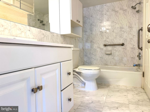 full bathroom with vanity, tiled shower / bath combo, and toilet