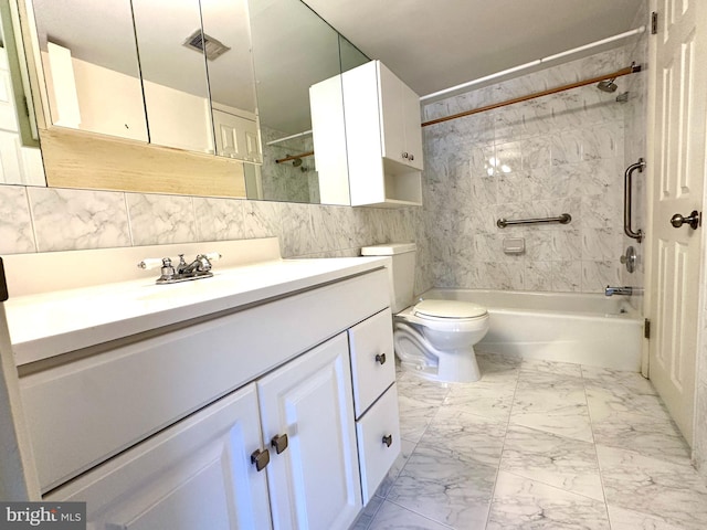 full bathroom featuring vanity, toilet, tile walls, and tiled shower / bath combo