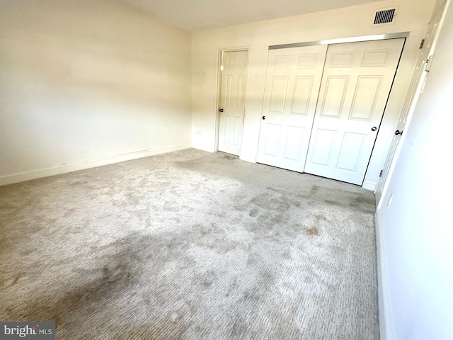 unfurnished bedroom with carpet floors