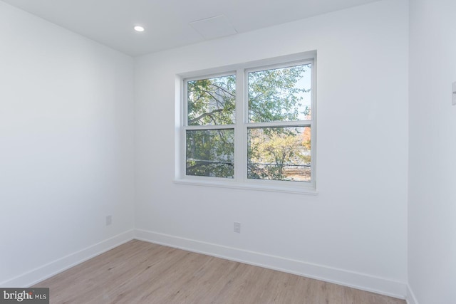 spare room with a healthy amount of sunlight and light wood-type flooring