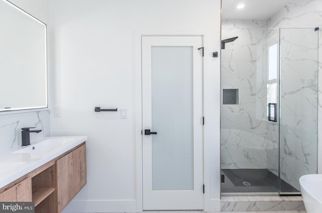 bathroom featuring vanity and a shower with shower door