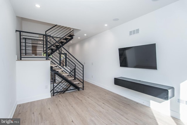 unfurnished living room featuring light wood-type flooring