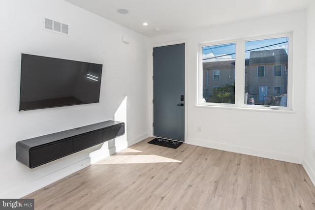 foyer with light hardwood / wood-style flooring