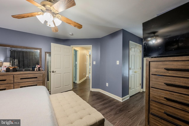 bedroom featuring ceiling fan and dark hardwood / wood-style flooring