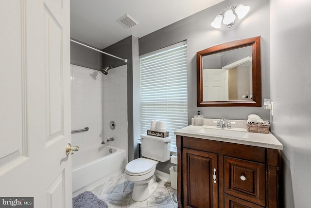 full bathroom with vanity, toilet, and tiled shower / bath