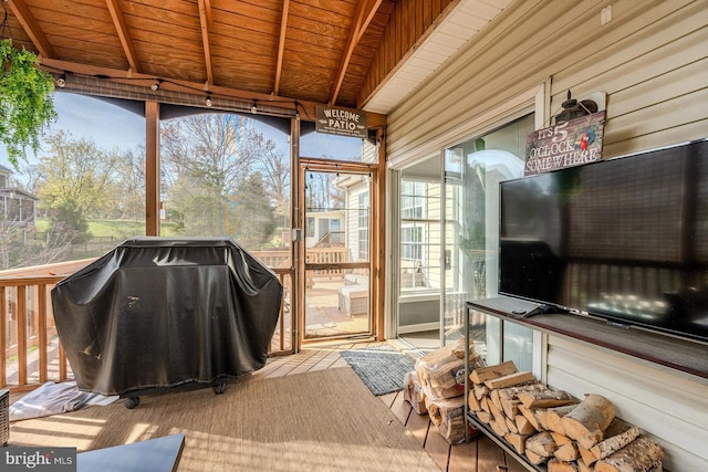 sunroom / solarium with beam ceiling and wood ceiling