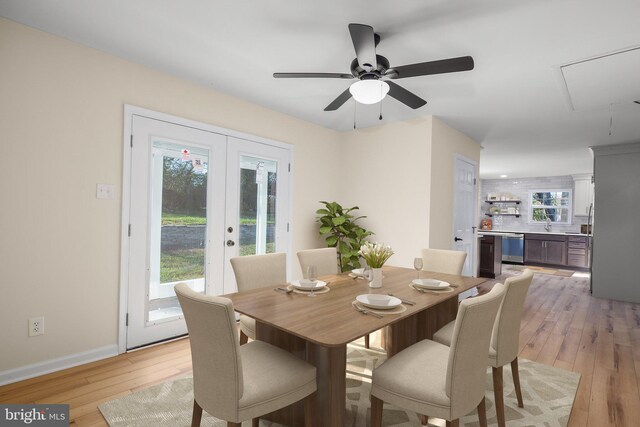 dining room featuring french doors, ceiling fan, and light hardwood / wood-style flooring