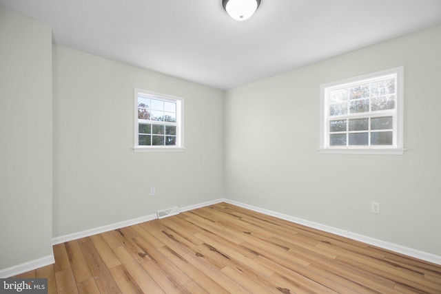 empty room featuring hardwood / wood-style flooring